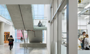 A view of the first floor of ECU's campus building, showing students walking through the halls.